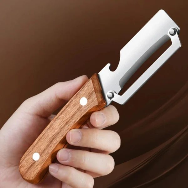 S085281a4f8da4b43a7738af3d569dfdeb.webp Stainless steel peeler with wooden handle for peeling and slicing fruits and vegetables | Durable and smooth operation