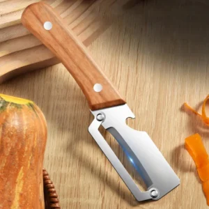 S5cb6b664d18749ccafdbbe3df60be88ad.webp Stainless steel peeler with wooden handle for peeling and slicing fruits and vegetables | Durable and smooth operation