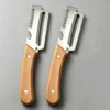 S7ebfc4b82fc74f668427ed0621c564917.webp Stainless steel peeler with wooden handle for peeling and slicing fruits and vegetables | Durable and smooth operation