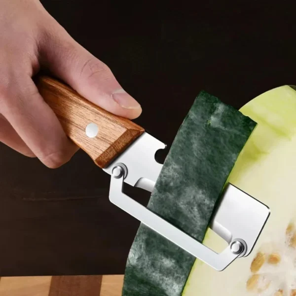 Saf8afcca0f9d4d2ab13b8e4ad7eb23f8B.webp Stainless steel peeler with wooden handle for peeling and slicing fruits and vegetables | Durable and smooth operation