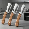 Scc2cb0aeb29f4decac813e4eb4c679113.webp Stainless steel peeler with wooden handle for peeling and slicing fruits and vegetables | Durable and smooth operation