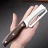 Sdc77bc9afe574c45b8eba06dfde8a1b7G.webp Stainless steel peeler with wooden handle for peeling and slicing fruits and vegetables | Durable and smooth operation